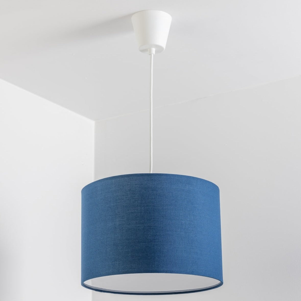 The Lucia is a modern cylinder drum shaped lamp shade in a luxury cotton finish and white opal diffuser. This fantastic shade can double up as either a ceiling pendant light shade or table lampshade. Easily fits to your standard ceiling light socket - no wiring required.