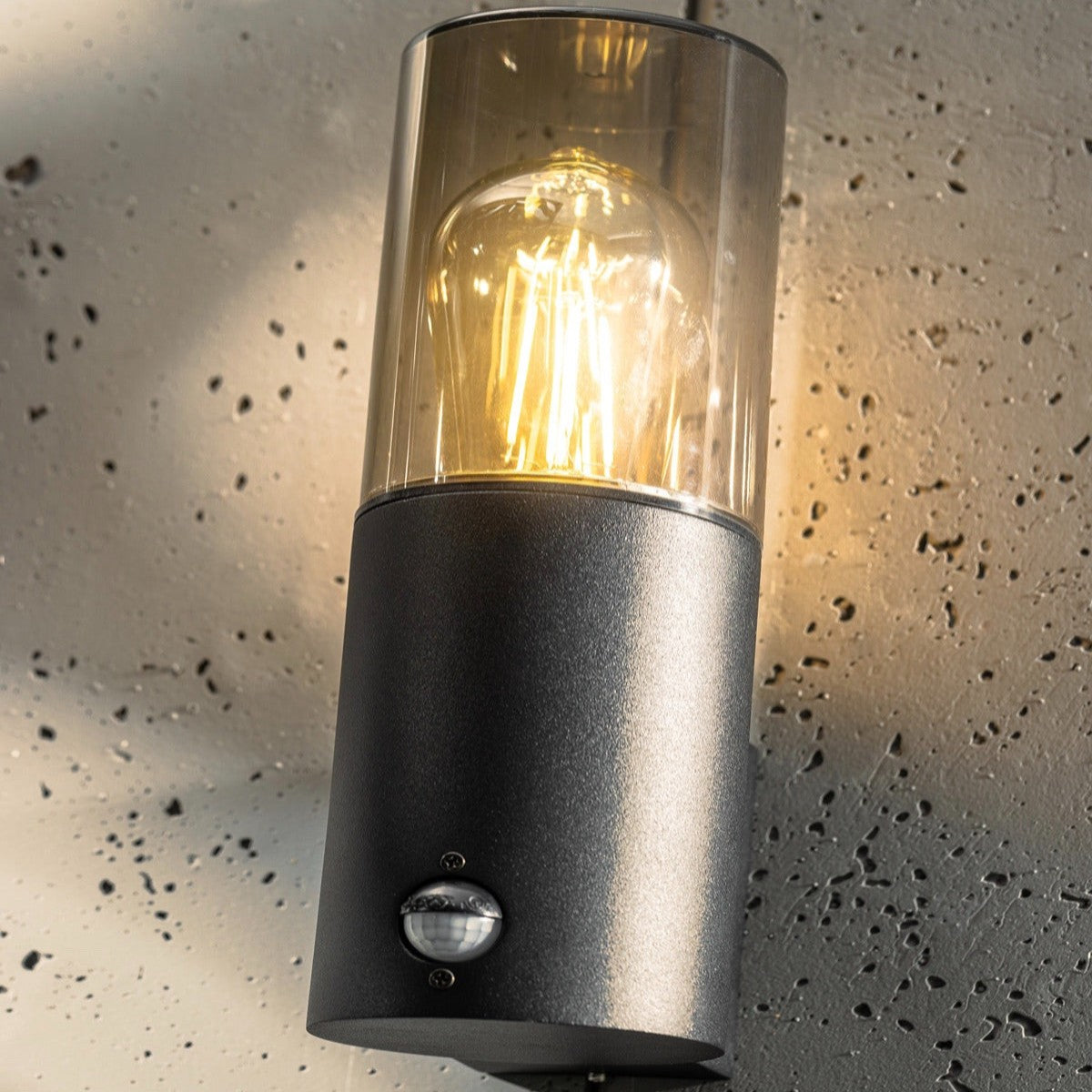 Explore our black cylinder wall light today, fit with a smoky diffuser and motion sensor features! If you require a valuable lighting system and an additional layer of security for your home’s outdoor space, then this lighting body can provide the right protection and style for you. 