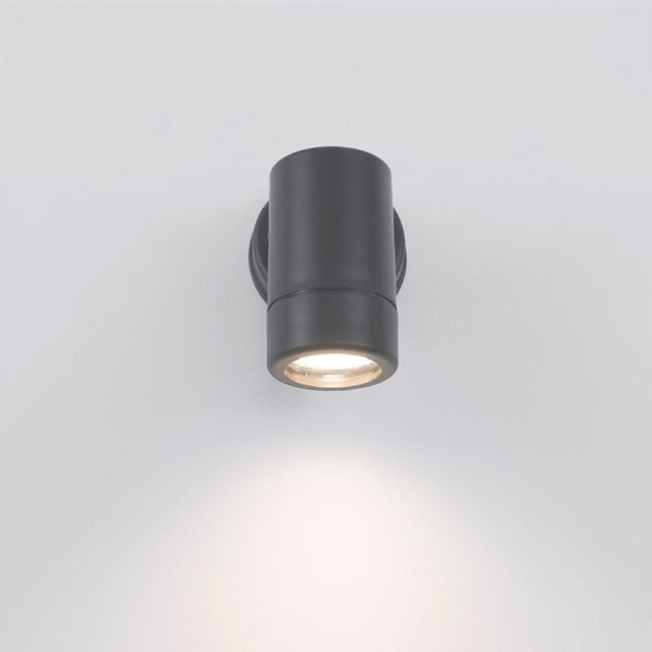 Our Valentine dark grey outdoor single spot cylinder wall light would look perfect in a modern or more traditional home design. Outside wall lights can provide atmospheric light in your garden, at the front door or on the terrace as well as a great security solution. It is designed for durability and longevity with its robust material producing a fully weatherproof and water resistant light fitting.  Use LED bulbs to make this light energy efficient and low cost to run.