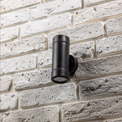 Our Valentine black outdoor wall mounted up and down cylinder outdoor light would look perfect in a modern or more traditional home design. Outside wall lights can provide atmospheric light in your garden, at the front door or on the terrace as well as a great security solution. It is designed for durability and longevity with its robust material producing a fully weatherproof and water-resistant light fitting. Use LED bulbs to make this light energy efficient and low cost to run.