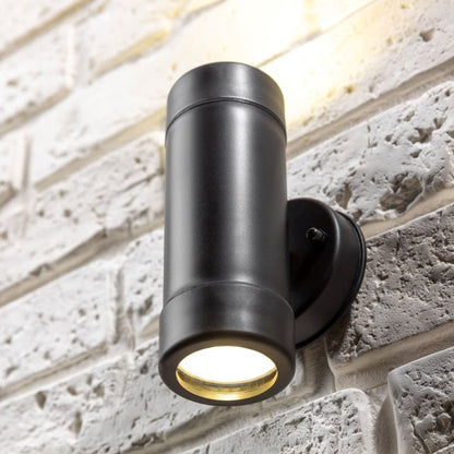 Our Valentine black outdoor wall mounted up and down cylinder outdoor light would look perfect in a modern or more traditional home design. Outside wall lights can provide atmospheric light in your garden, at the front door or on the terrace as well as a great security solution. It is designed for durability and longevity with its robust material producing a fully weatherproof and water-resistant light fitting. Use LED bulbs to make this light energy efficient and low cost to run.