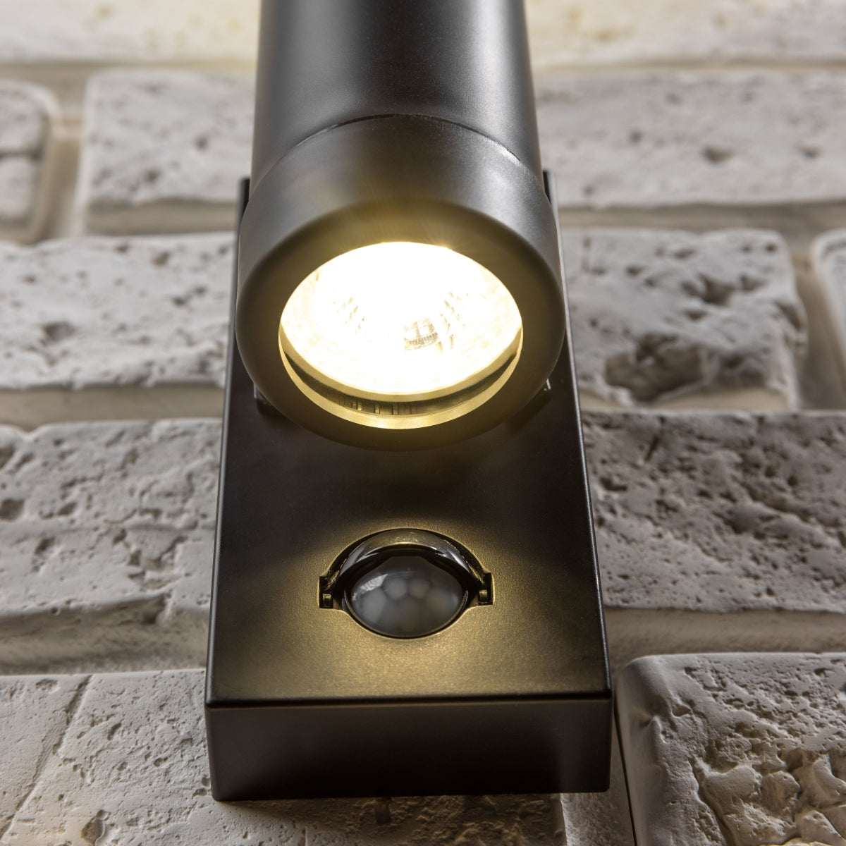 Our Valentine black outdoor wall mounted up and down cylinder outdoor light with motion sensor would look perfect in a modern or more traditional home design. Outside wall lights can provide atmospheric light in your garden, at the front door or on the terrace as well as a great security solution.