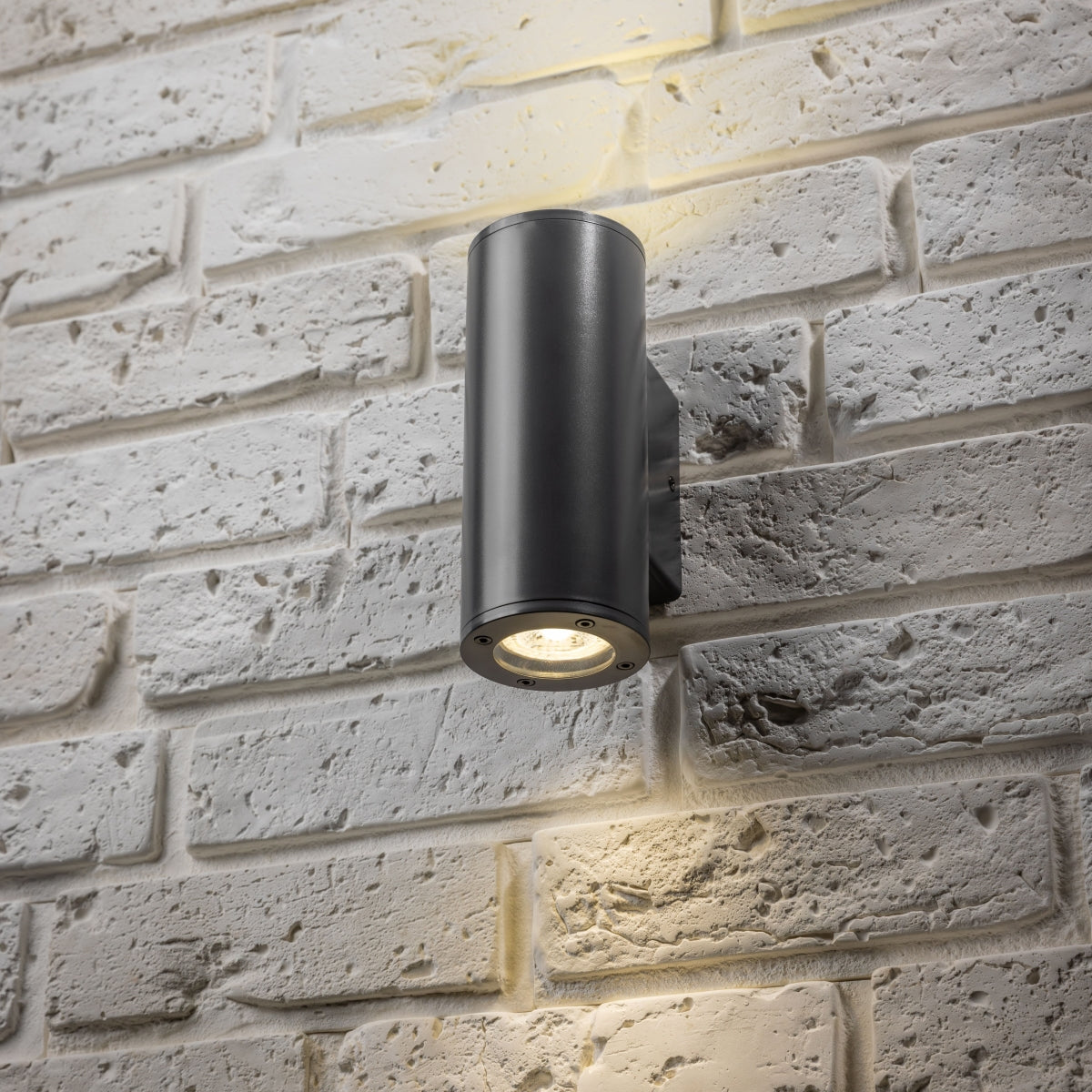 Our Sherri dark grey cylinder up and down wall light would look perfect in a modern or more traditional home design. Outside lights can provide atmospheric light in your garden, at the front door or on the terrace as well as a great security solution. It is designed for durability and longevity with its robust material producing a fully weatherproof and water resistant light fitting