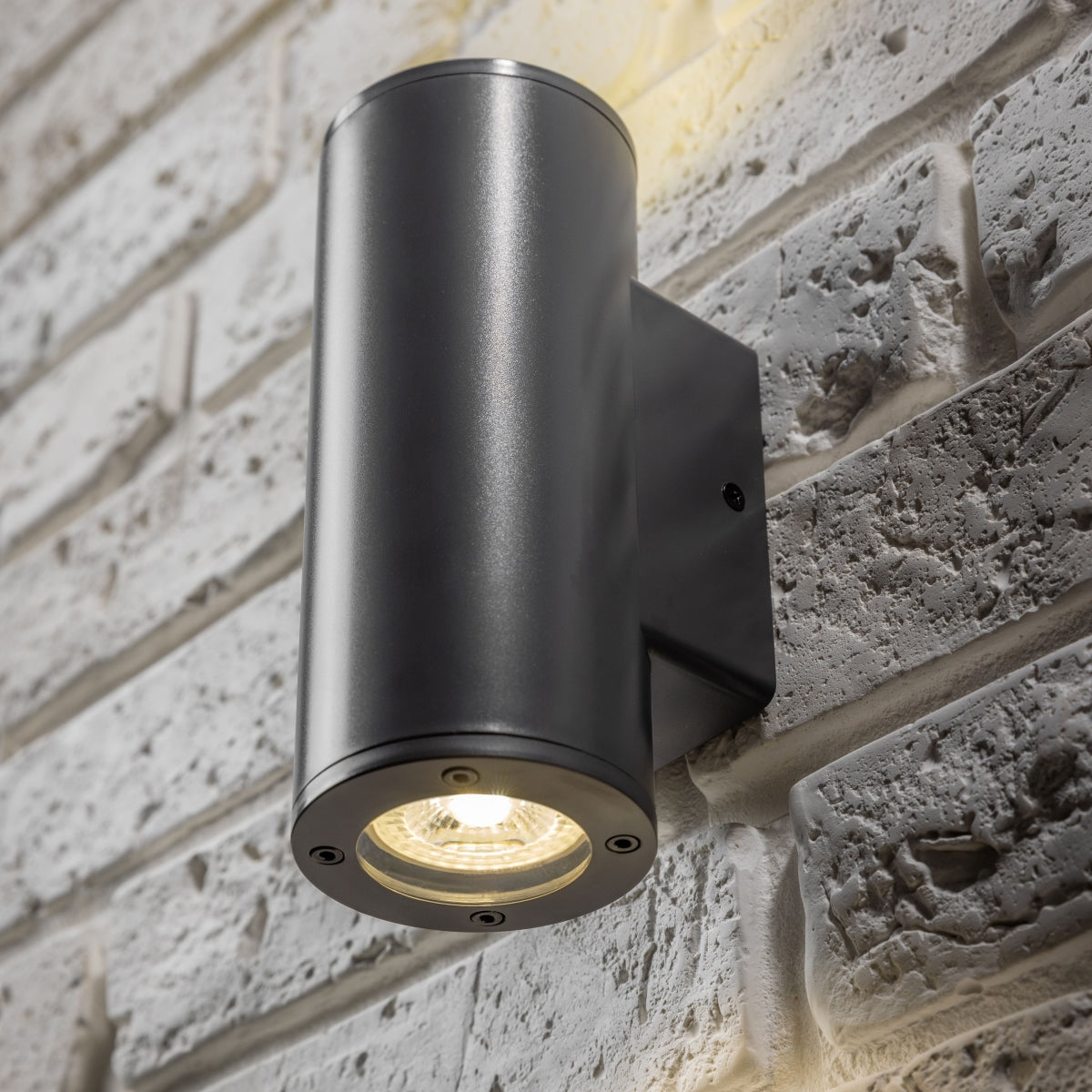 Our Sherri dark grey cylinder up and down wall light would look perfect in a modern or more traditional home design. Outside lights can provide atmospheric light in your garden, at the front door or on the terrace as well as a great security solution. It is designed for durability and longevity with its robust material producing a fully weatherproof and water resistant light fitting