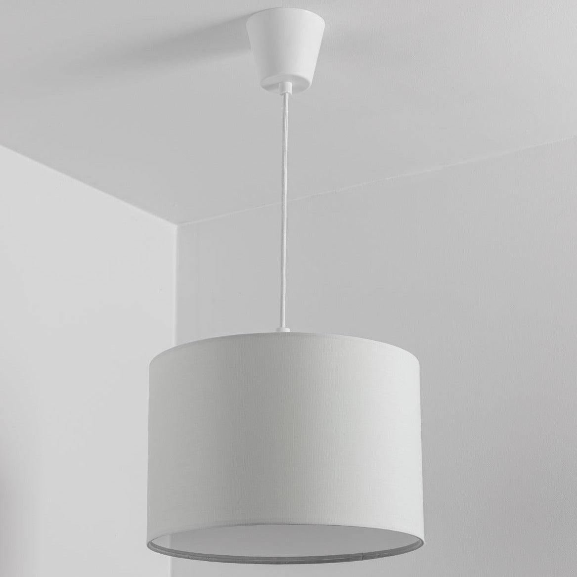 The Lucia is a modern cylinder drum shaped lamp shade in a luxury cotton finish and opal diffuser. This fantastic shade can double up as either a ceiling pendant light shade or table lampshade. Easily fits to your standard ceiling light socket - no wiring required.