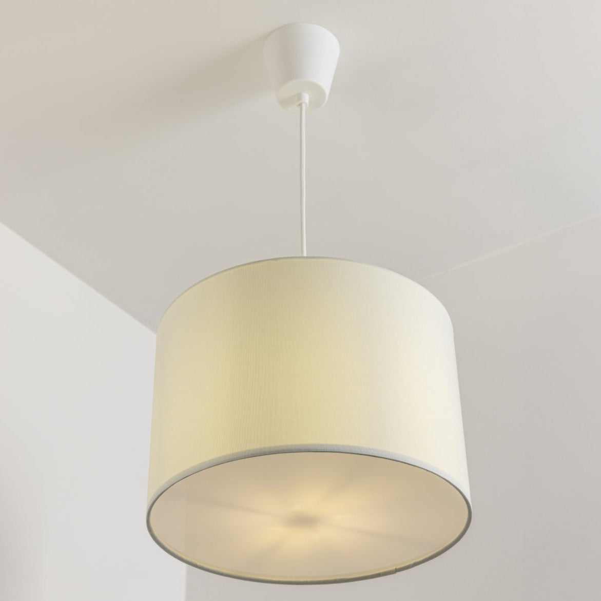 The Lucia is a modern cylinder drum shaped lamp shade in a luxury cotton finish and opal diffuser. This fantastic shade can double up as either a ceiling pendant light shade or table lampshade. Easily fits to your standard ceiling light socket - no wiring required.