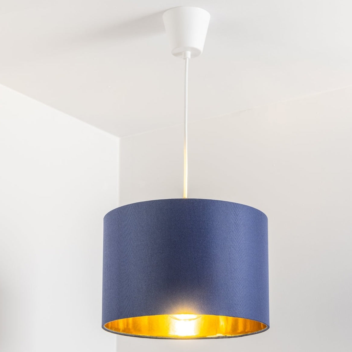 Our Lupo luxury cotton shade is sophisticated in appearance and we have designed the shade to suit a range of interiors. Easy to fit, it’s crafted from high-quality cotton on the outer and has a reflective gold metallic inner. It's made to fit both a ceiling light or lamp base.