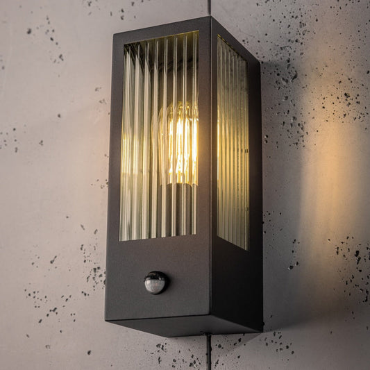 If you’re looking for a modern take on a traditional outdoor wall light, this modern bevelled glass rectangle wall light is perfect for adding style and protection for your home. This classic wall light is designed with a contemporary twist, styled with a rectangle shape and fitted with glass bevelled windows that allow the light to shine effectively. Integrated PIR Motion Sensor.