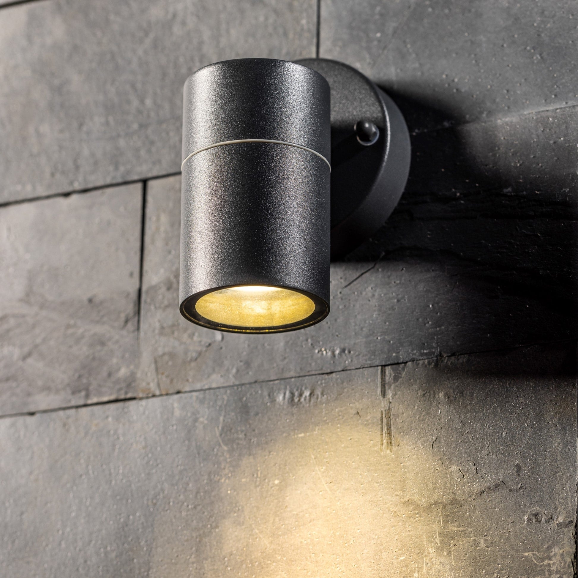 Our Mia outdoor single down light is modern and stylish in its appearance.  It comes in a cylinder design mounted on a circular back plate. It is designed for durability and longevity with its robust material producing a fully weatherproof and water resistant light fitting