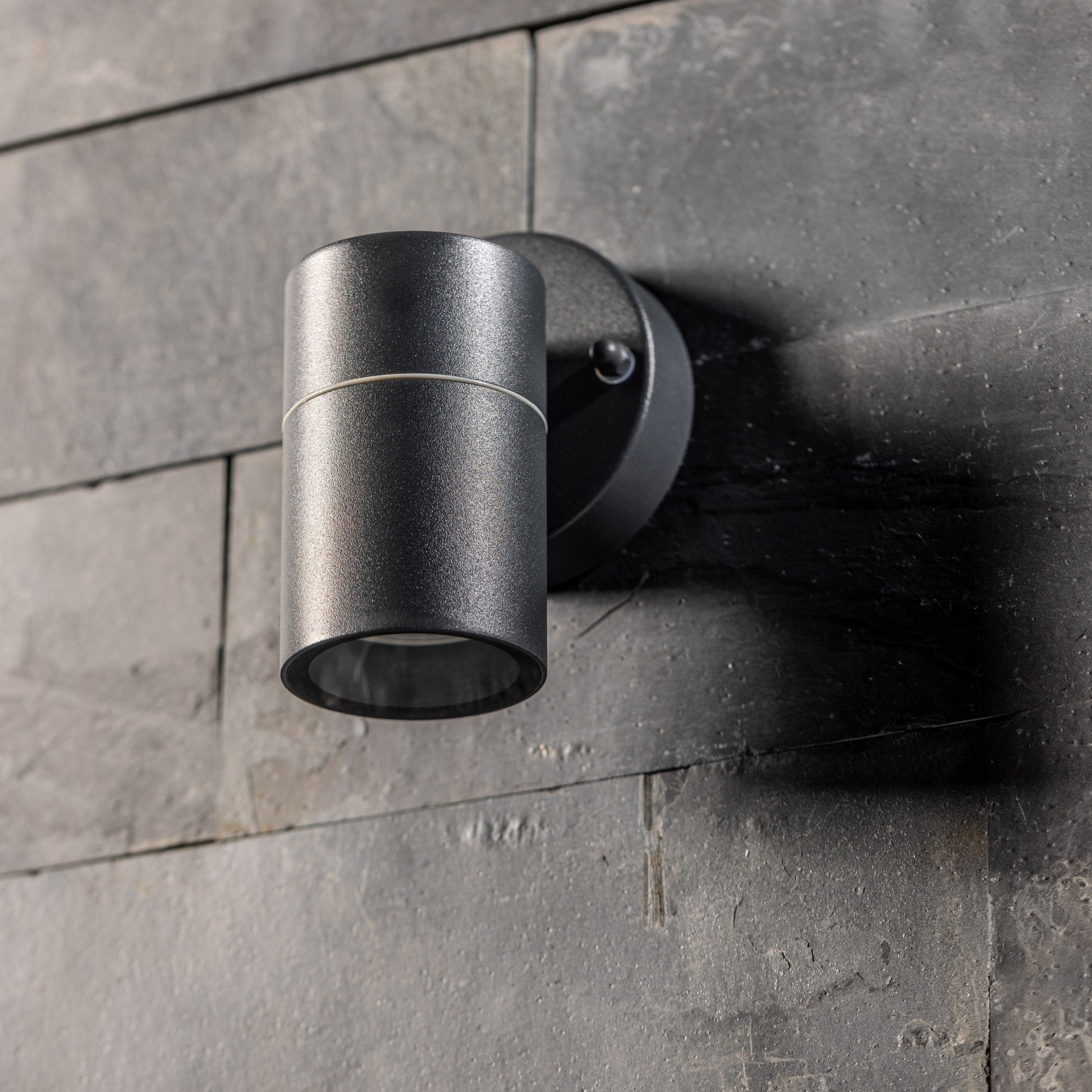 Our Mia outdoor single down light is modern and stylish in its appearance.  It comes in a cylinder design mounted on a circular back plate. It is designed for durability and longevity with its robust material producing a fully weatherproof and water resistant light fitting