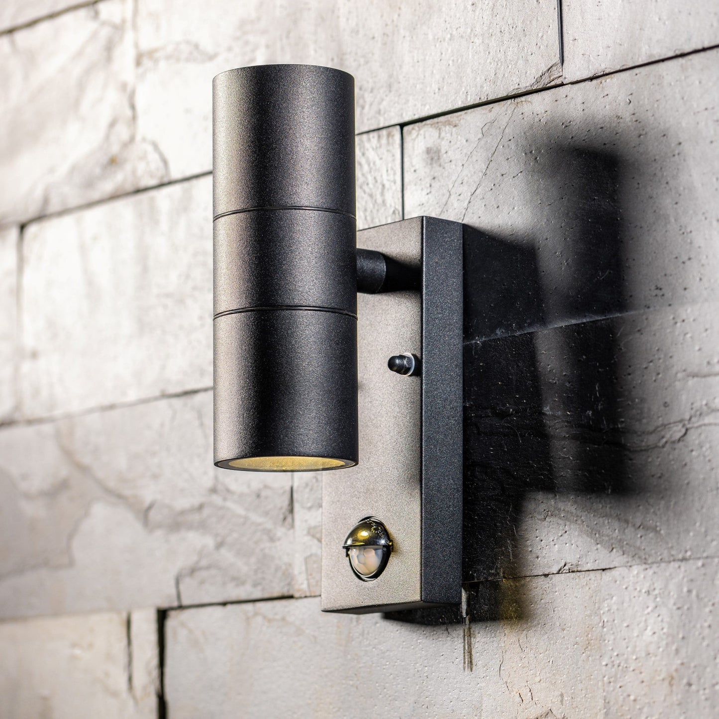 Our Leon outdoor single down light is modern and stylish in its appearance.  It comes in a cylinder design mounted on a rectangle back plate complete with clear glass diffuser and built in PIR motion sensor. It is designed for durability and longevity with its robust material producing a fully weatherproof and water resistant light fitting