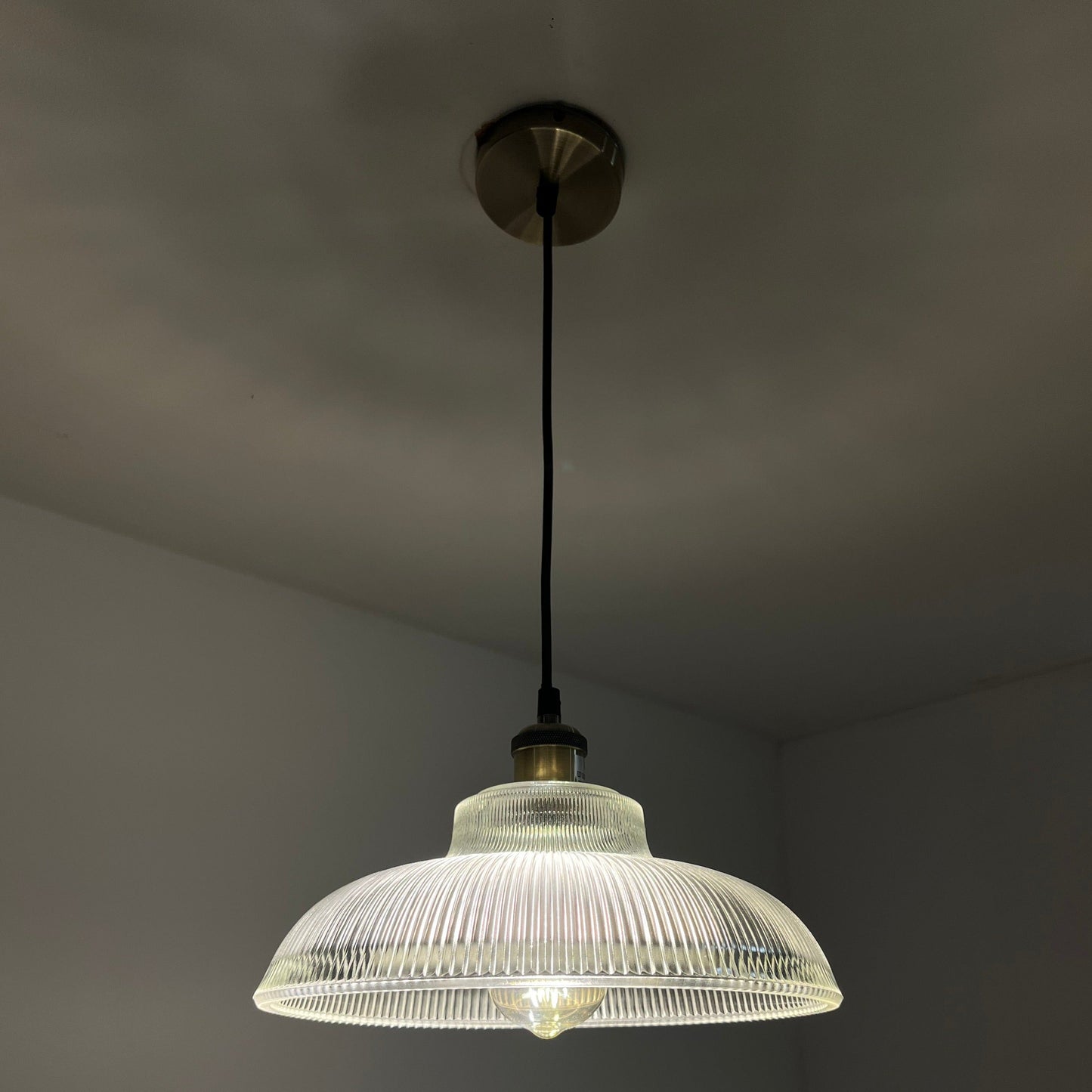 Glass lighting has proven very popular in the lighting sector, and we are extremely happy to introduce the Jacinta to our range. Our ribbed glass easy fit light pendant is a very attractive light fitting and easy fit means you can give your room a makeover by simply attaching it to an existing light fitting.