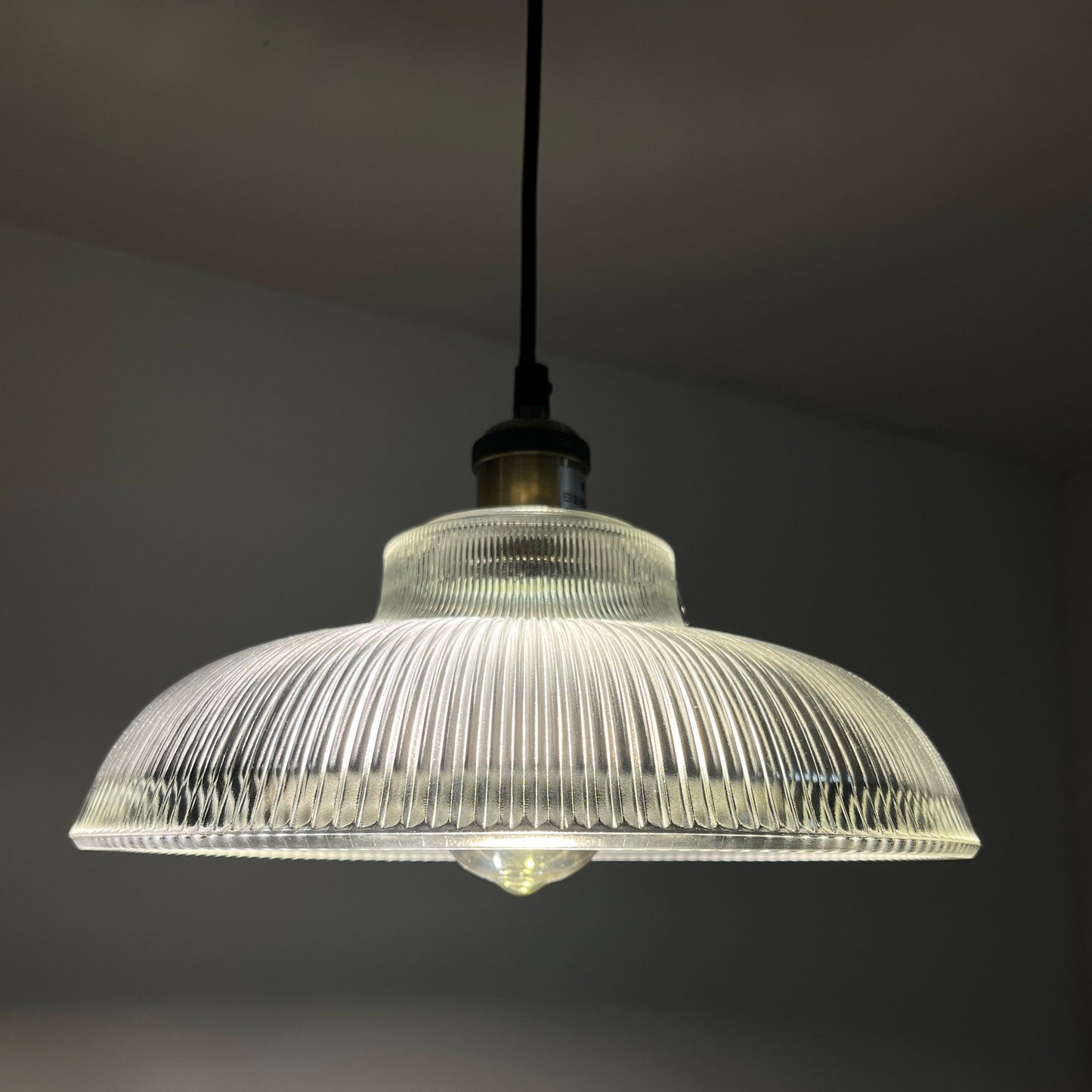 Glass lighting has proven very popular in the lighting sector, and we are extremely happy to introduce the Jacinta to our range. Our ribbed glass easy fit light pendant is a very attractive light fitting and easy fit means you can give your room a makeover by simply attaching it to an existing light fitting.